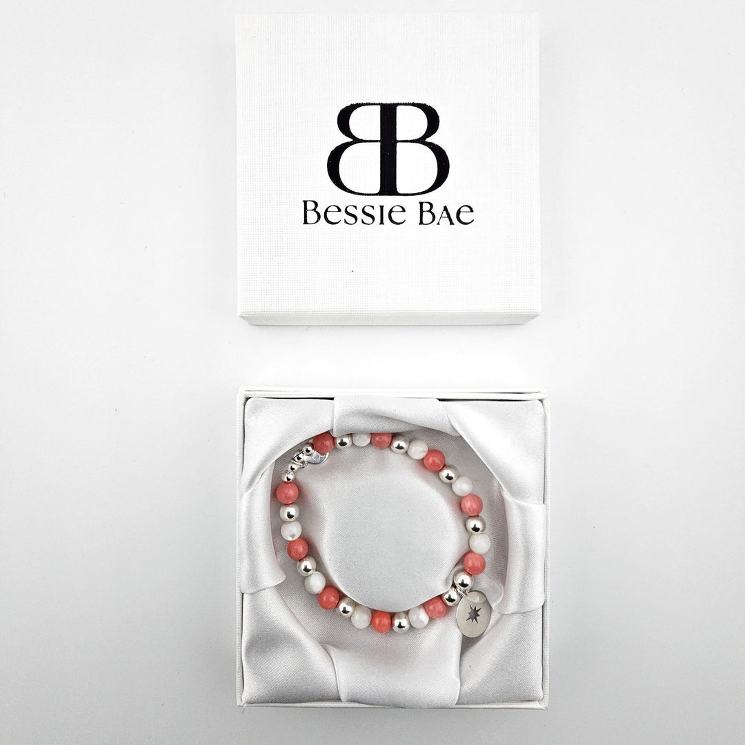 Compass bracelet displayed in Bessie Bae gift box on white background.
