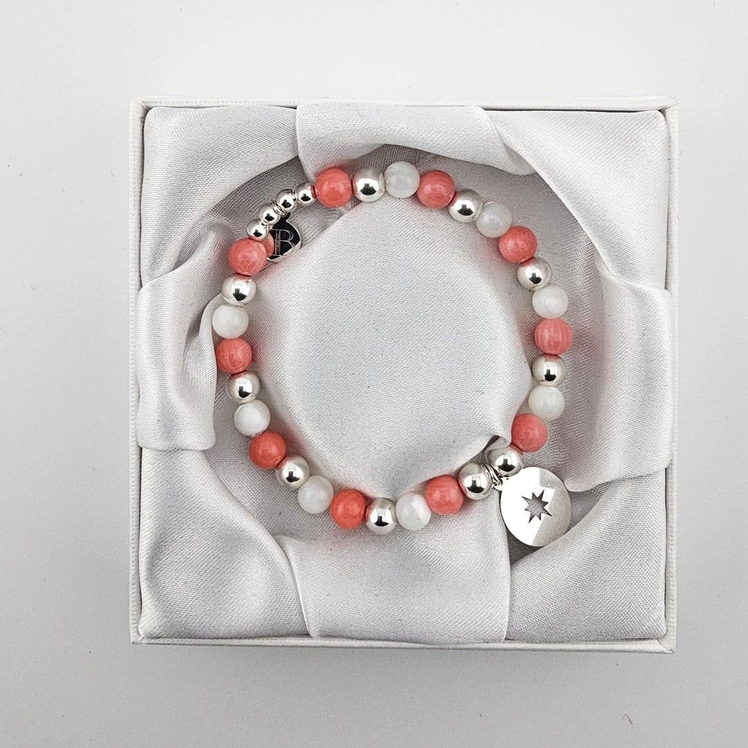 Handcrafted sterling silver and mother of pearl bracelet in satin gift box.