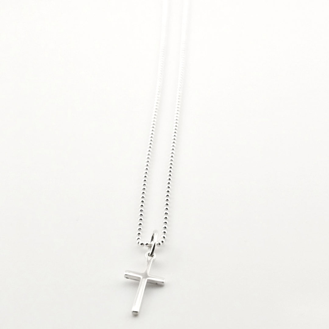 Sterling silver cross pendant necklace on ball chain, minimalist Christian jewellery.