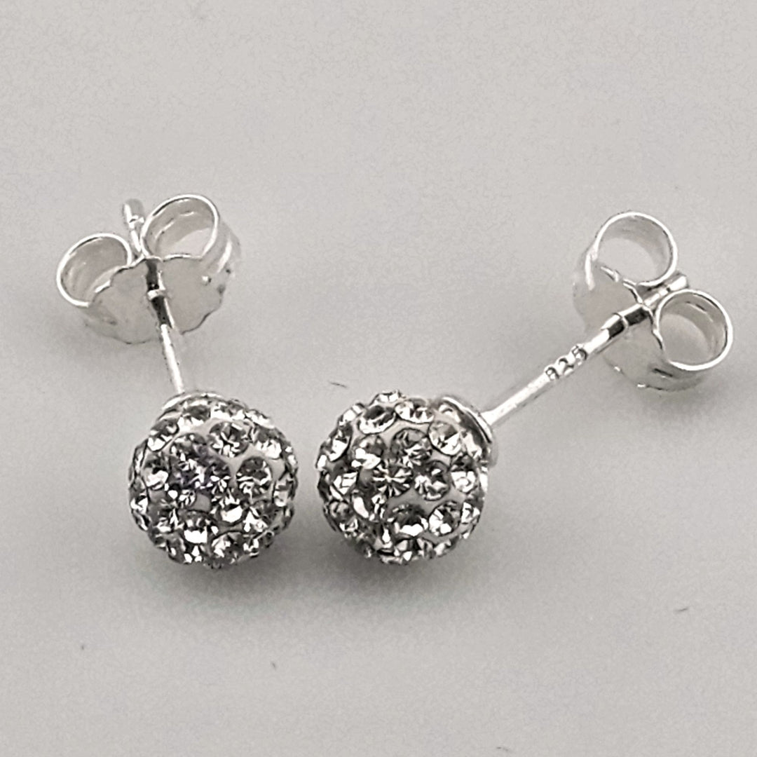 Sparkly round silver stud earrings with crystals.