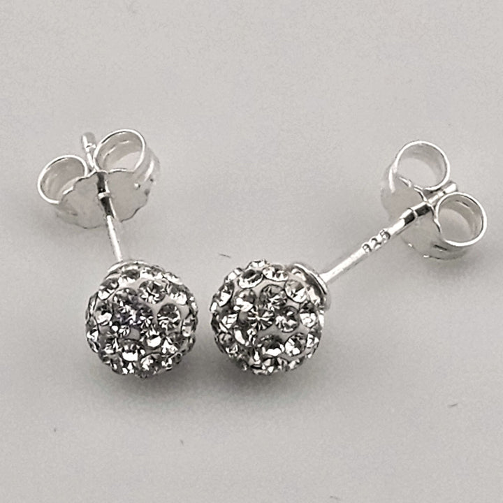 Sparkly round silver stud earrings with crystals.