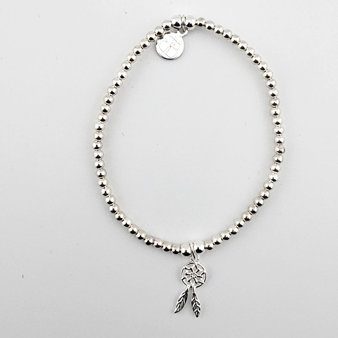Sterling Silver Dreamcatcher Bracelet with beaded design and feather charm.