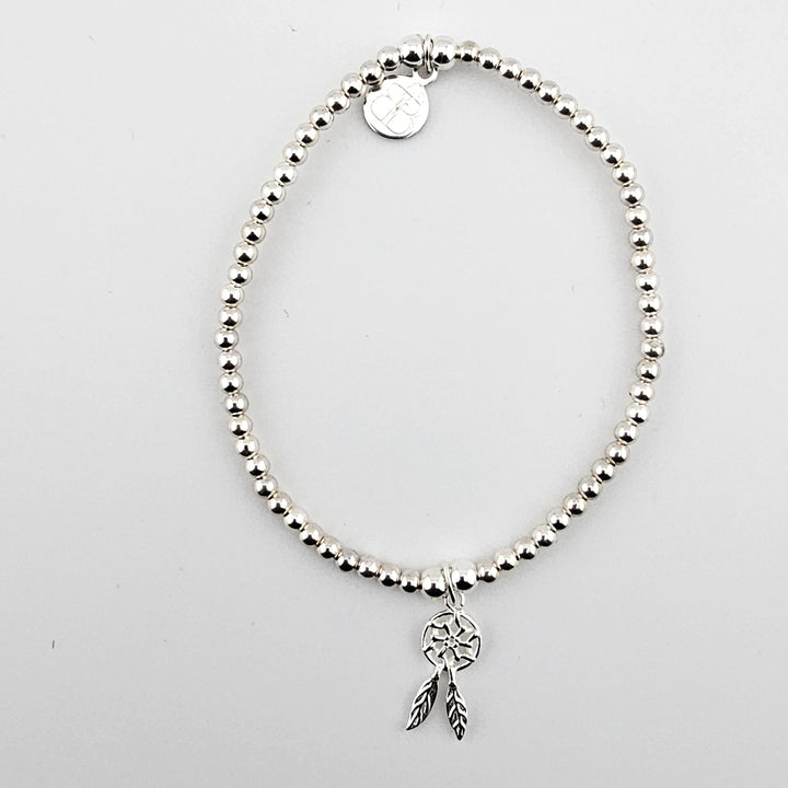 Sterling Silver Dreamcatcher Bracelet with beaded design and feather charm.