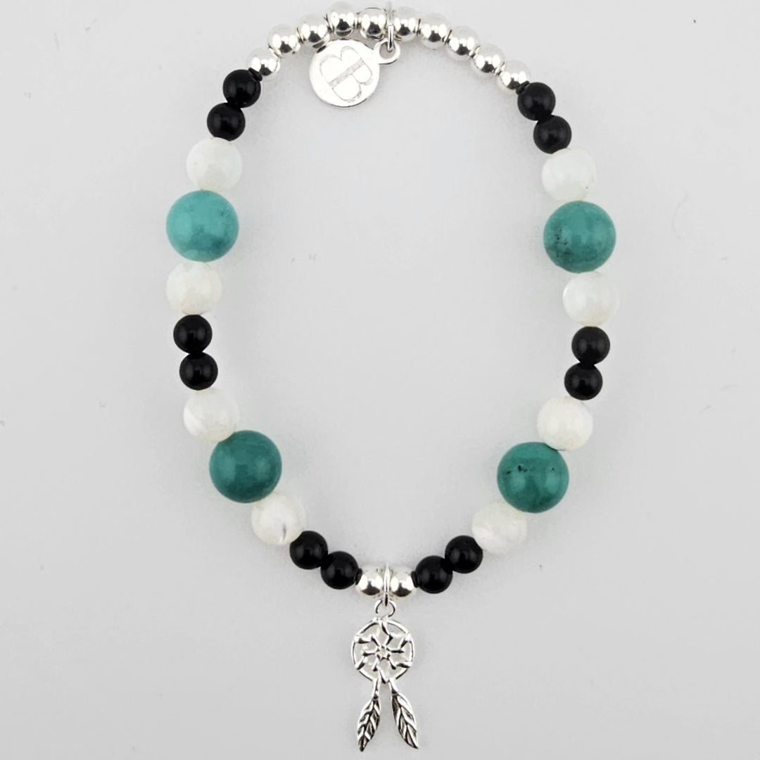 Sterling silver dreamcatcher bracelet with turquoise, black onyx and mother of pearl beads.