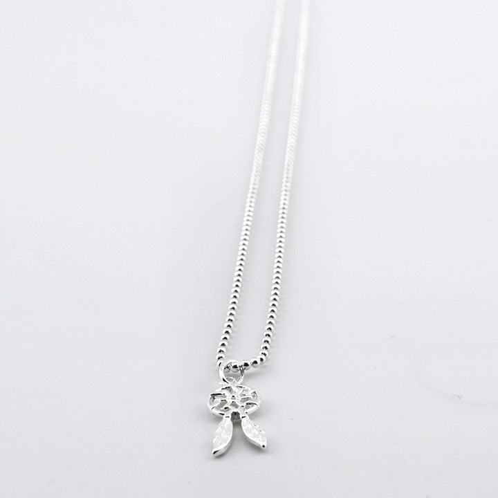 Sterling silver dreamcatcher pendant necklace with two feather charms on chain.