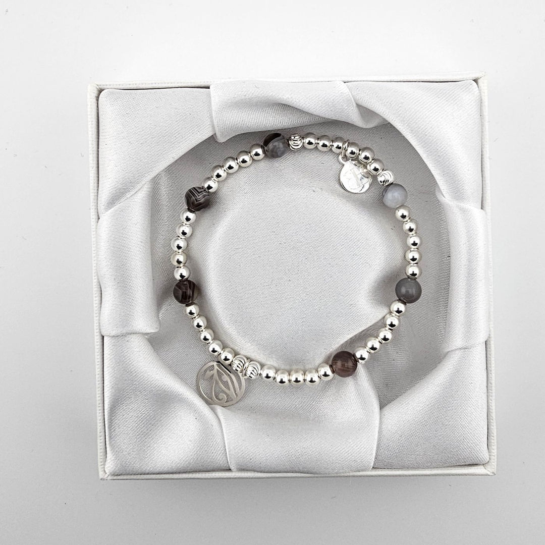 Handcrafted sterling silver and Botswana agate bracelet in satin box.