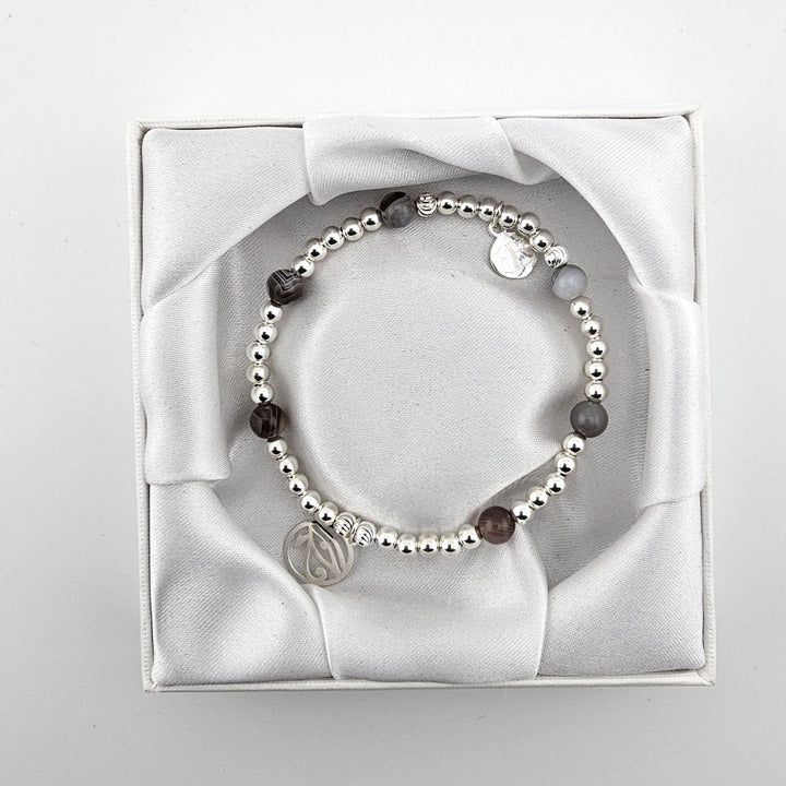 Handcrafted sterling silver and Botswana agate bracelet in satin box.