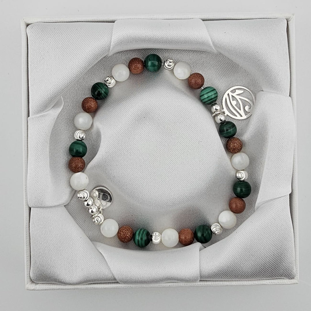 Malachite and goldstone beaded bracelet with symbolic Eye of Horus pendant.