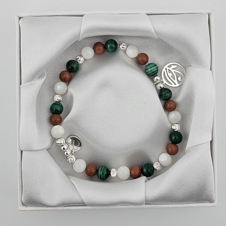 Malachite and goldstone beaded bracelet with symbolic Eye of Horus pendant.