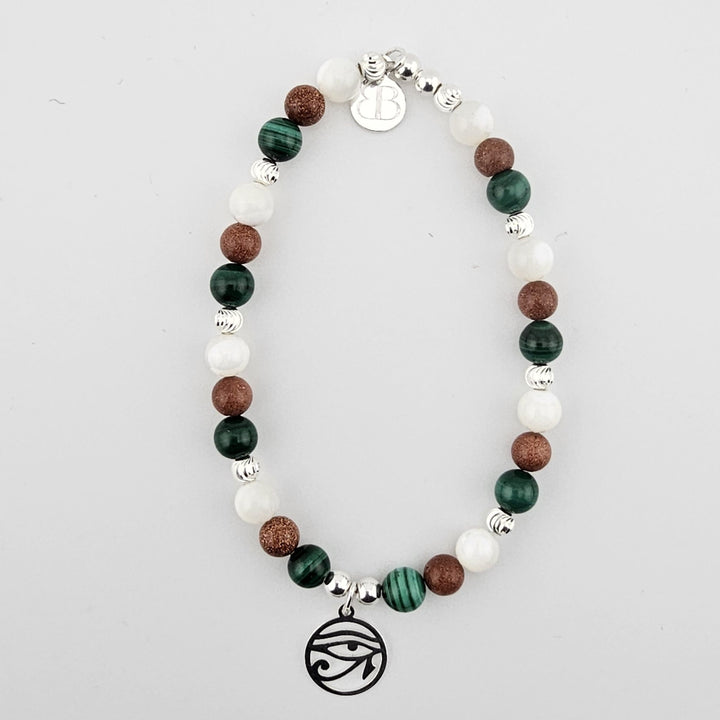 Sterling silver Eye of Horus bracelet with malachite, goldstone and mother of pearl beads.
