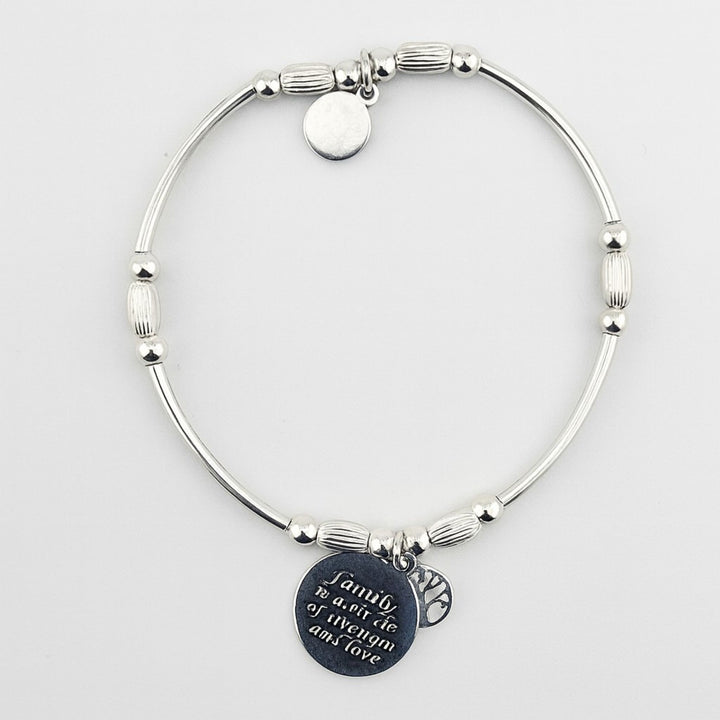 Sterling silver bracelet engraved with “Family is a circle of strength and love”.