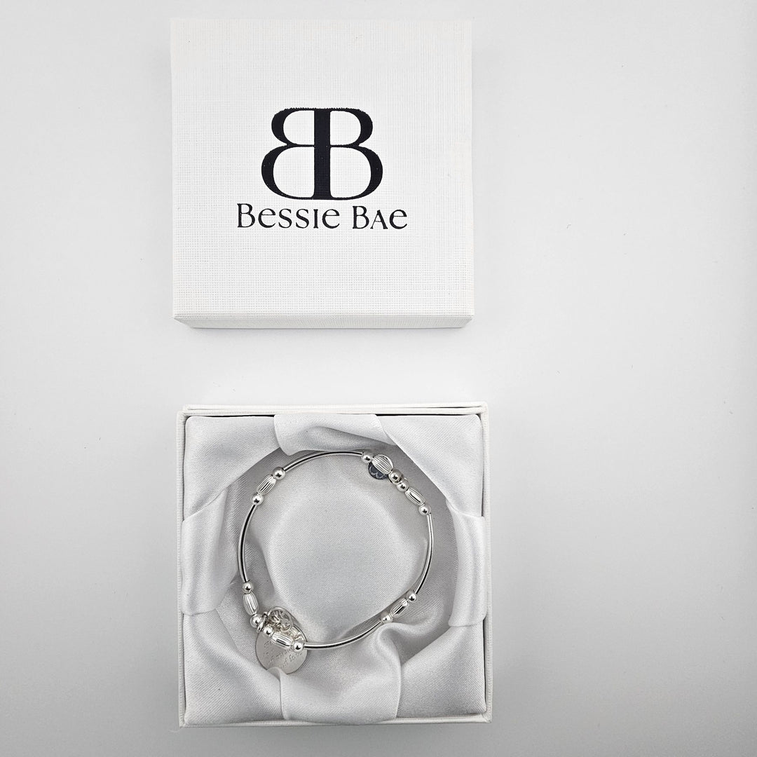 Family circle charm bracelet made from sterling silver.