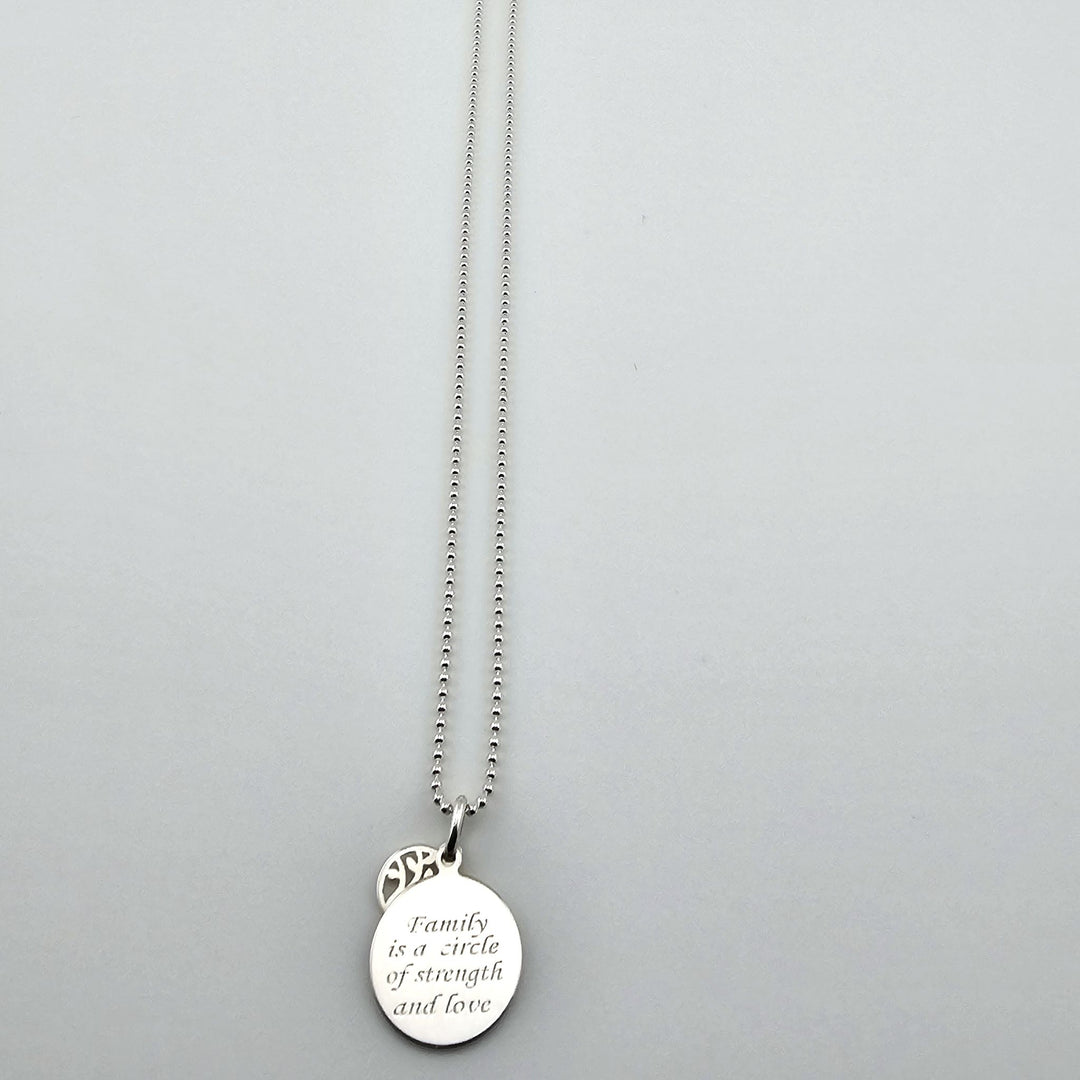 Sterling silver family necklace with engraved disc pendant and chain.