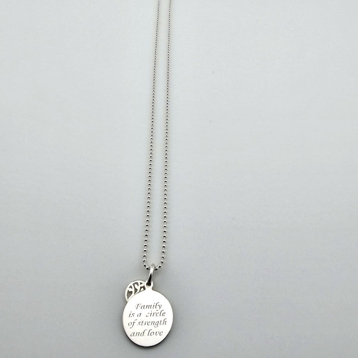 Sterling silver family necklace with engraved disc pendant and chain.