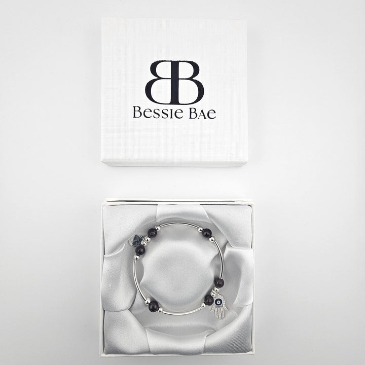 Sterling silver beaded bracelet with deep red garnet gemstones.