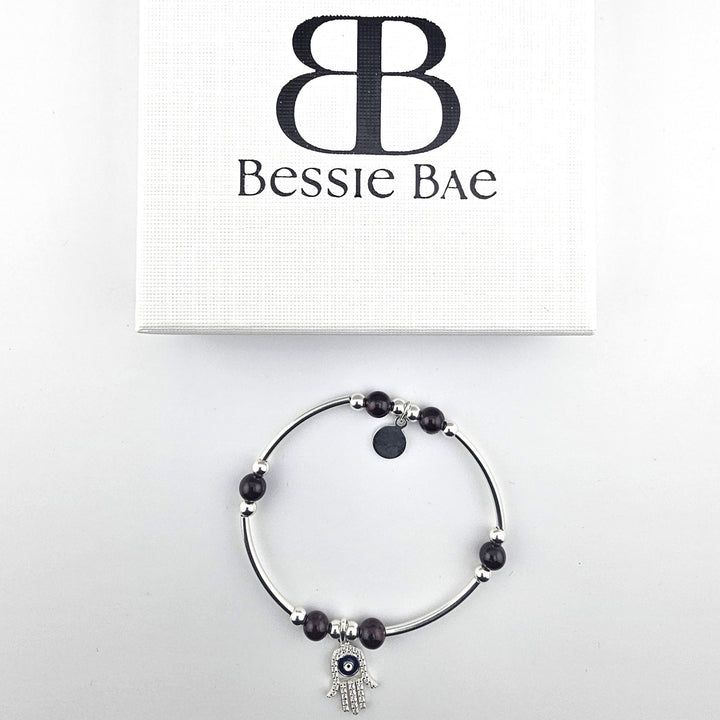 Elegant Hamsa charm bracelet symbolising luck and protection.