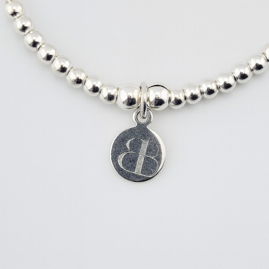 Handmade sterling silver heart key charm bracelet UK.