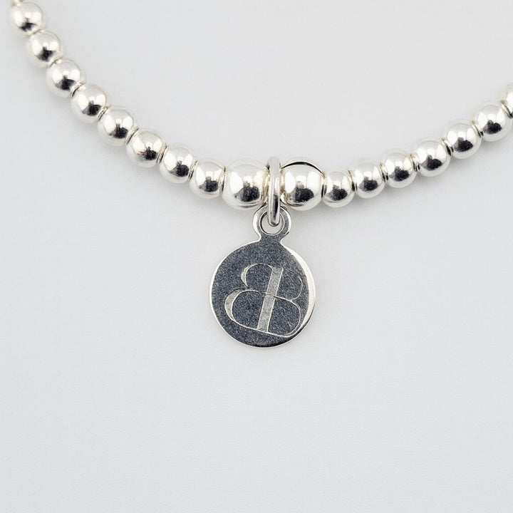 Handmade sterling silver heart key charm bracelet UK.