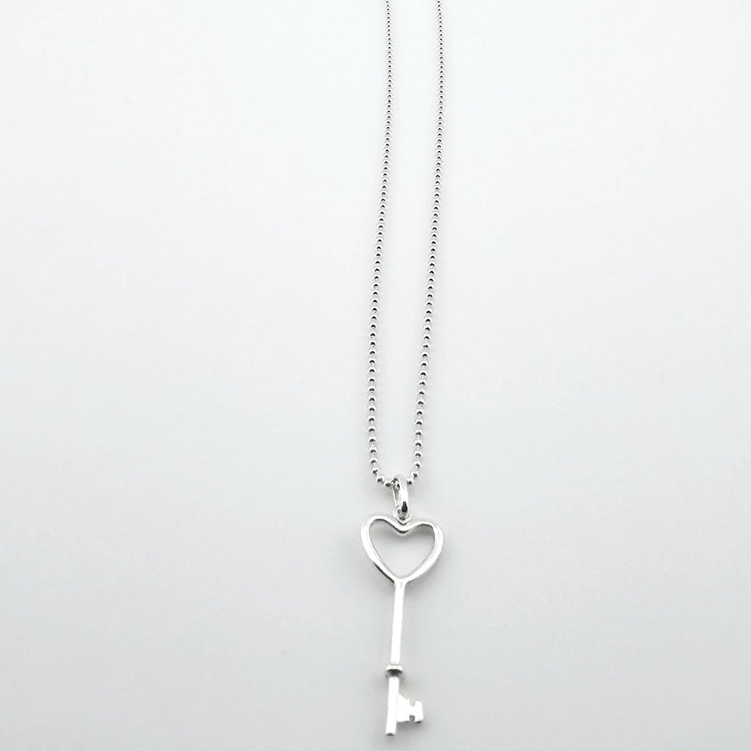 Sterling silver heart key pendant necklace symbolising love and romance.
