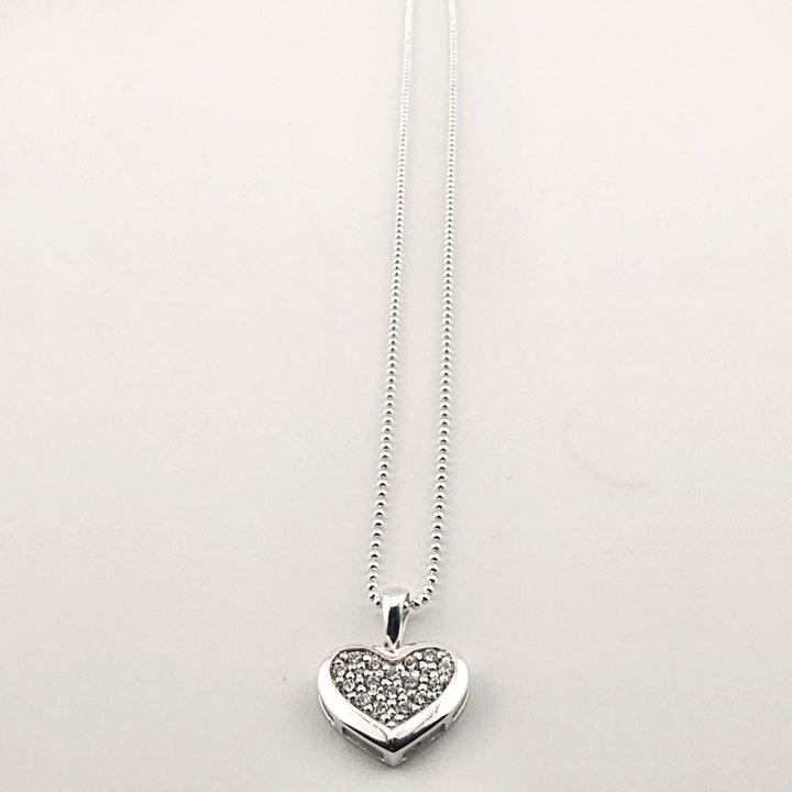 Sterling silver heart pendant necklace with sparkling pavé stones on ball chain.