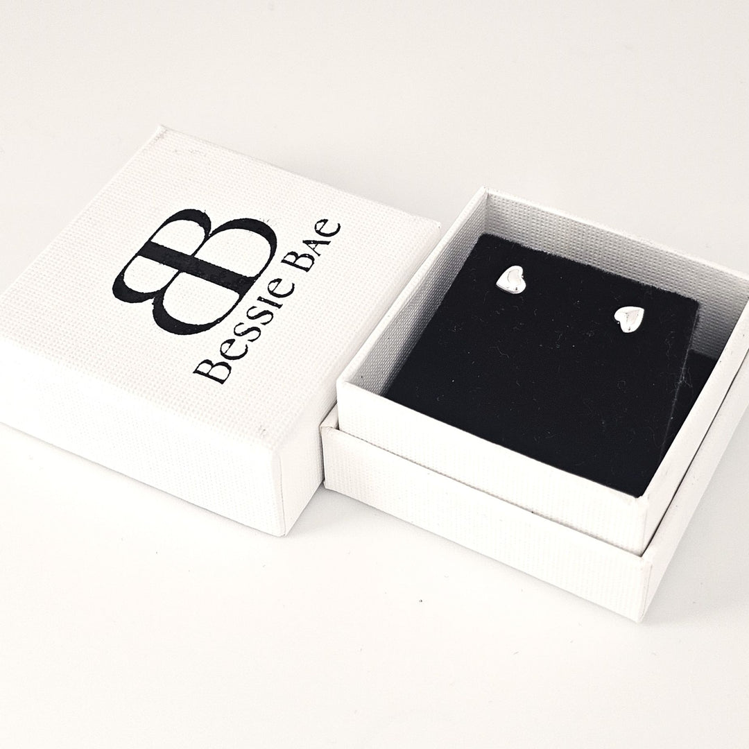 Sterling silver heart stud earrings minimalist design.