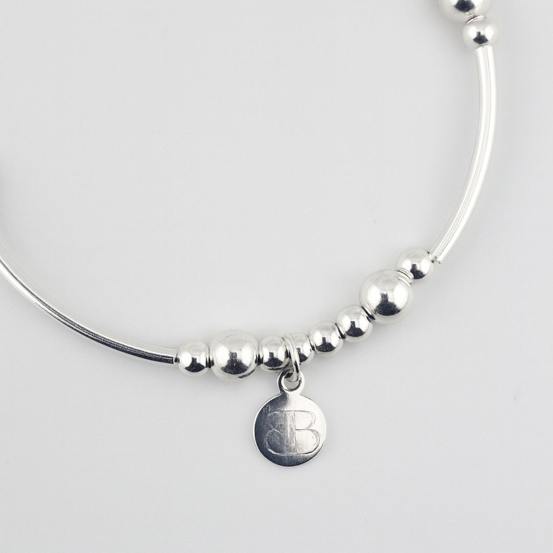 Elegant silver bracelet engraved with I Love You to the Moon and Back.