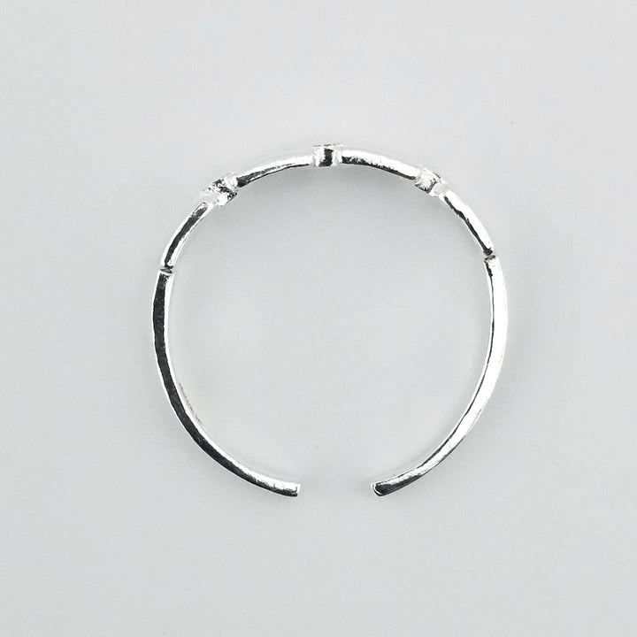 Adjustable silver chain ring for women.