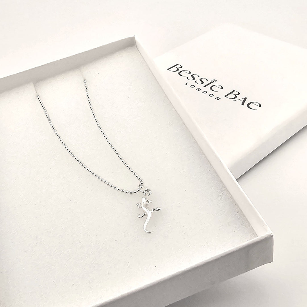 Sterling silver lizard pendant necklace on fine chain, polished finish, in box.