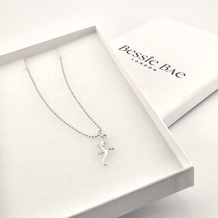 Sterling silver lizard pendant necklace on fine chain, polished finish, in box.