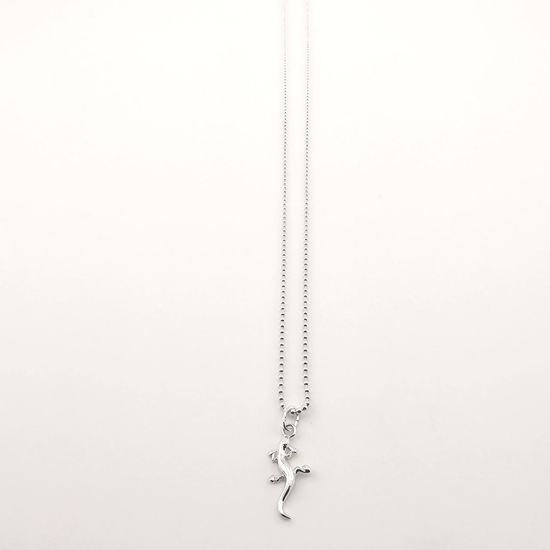 Unisex sterling silver lizard necklace, symbolic animal pendant gift.