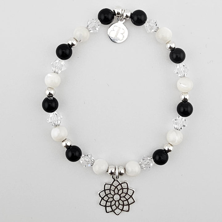 Sterling Silver Lotus Flower Bracelet with black onyx and mother of pearl gemstone beads.