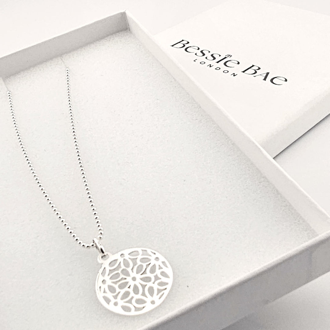 Spiritual silver mandala necklace symbolising harmony and balance.