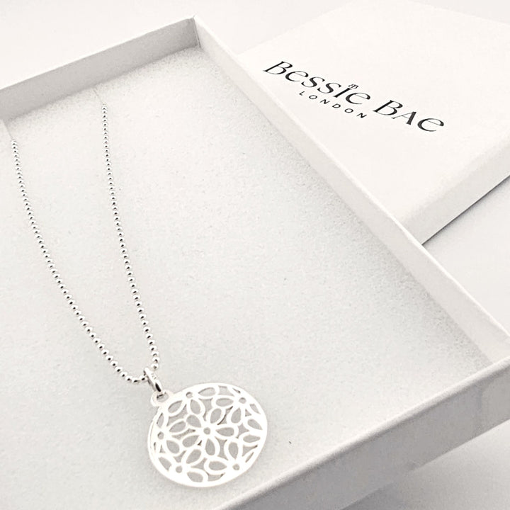 Spiritual silver mandala necklace symbolising harmony and balance.