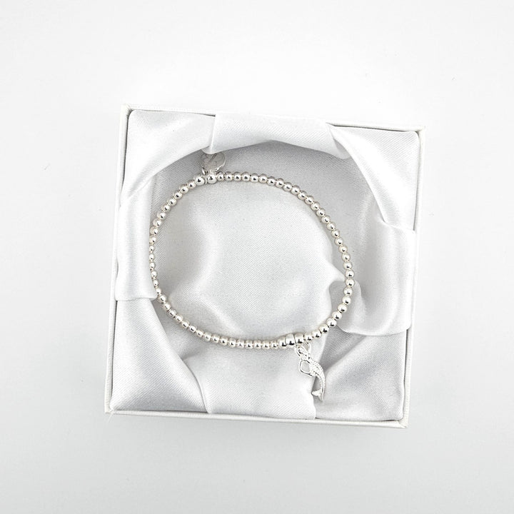 Elegant silver bracelet with ocean-inspired mermaid charm.