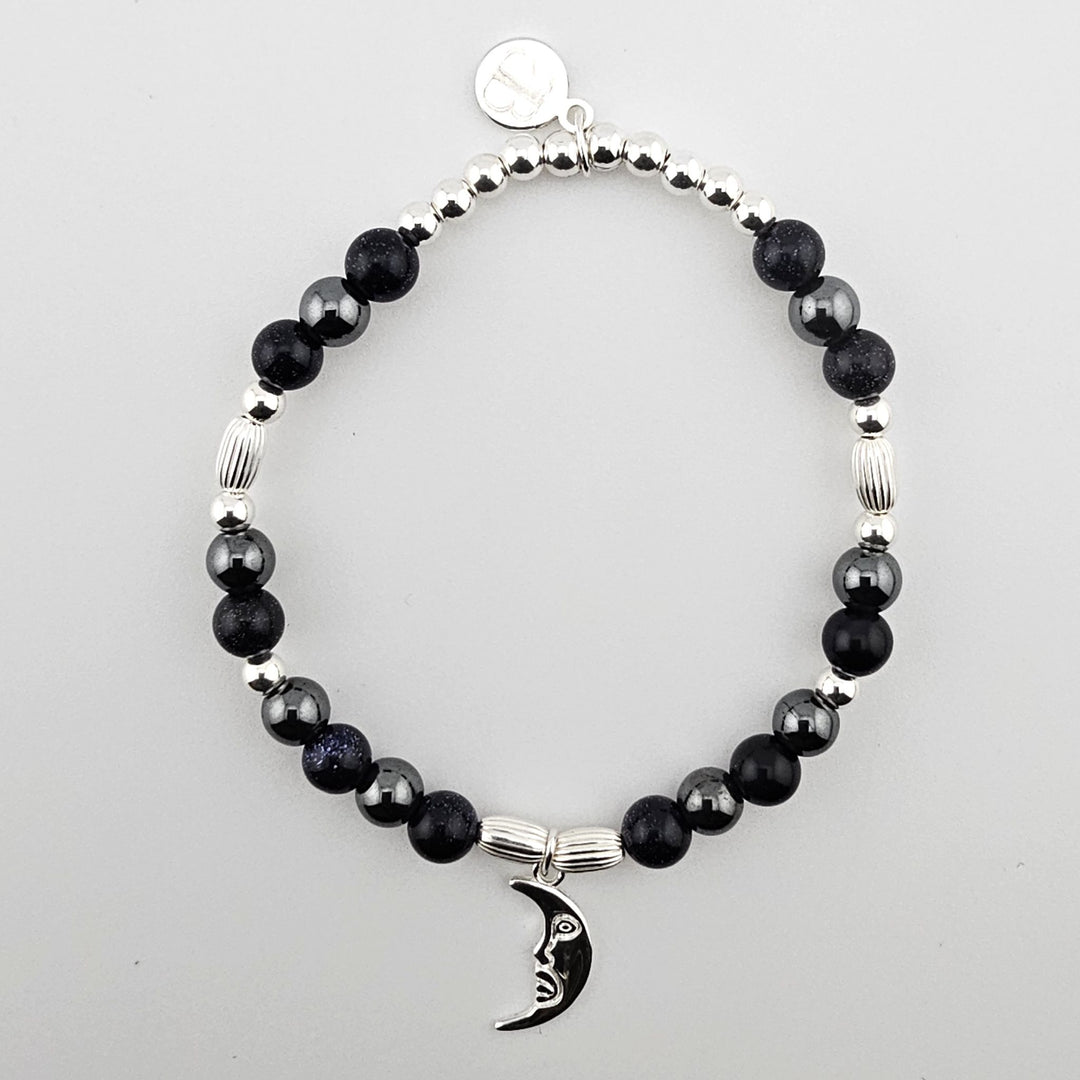 Sterling Silver Crescent Moon Bracelet with Blue Goldstone and Hematite by Bessie Bae.