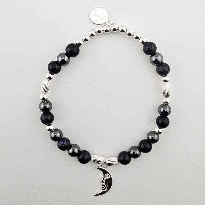 Sterling Silver Crescent Moon Bracelet with Blue Goldstone and Hematite by Bessie Bae.