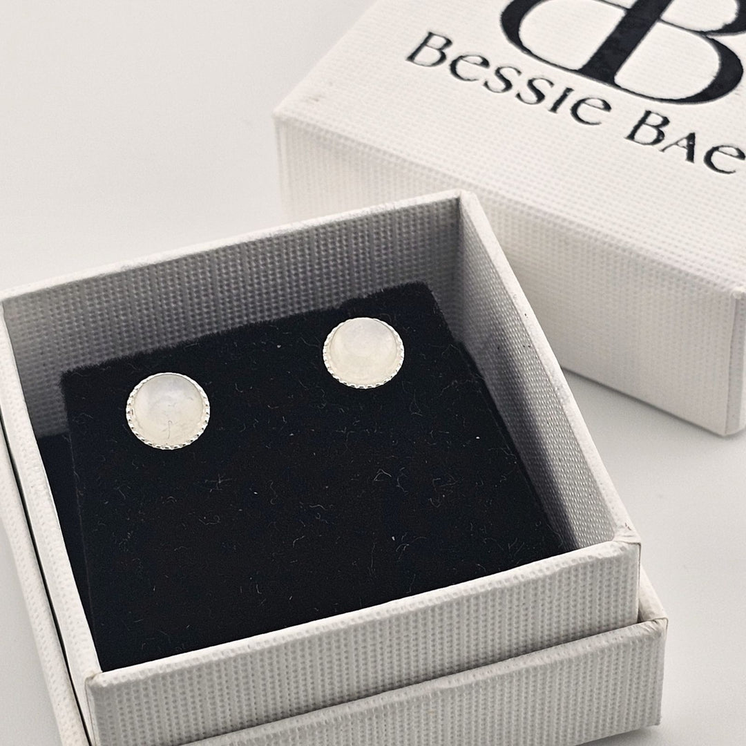 Minimalist sterling silver studs featuring natural moonstone.