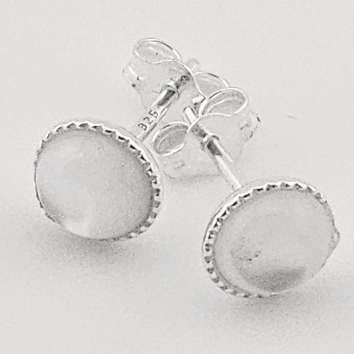 Sterling silver moonstone stud earrings with round cabochon gemstone.
