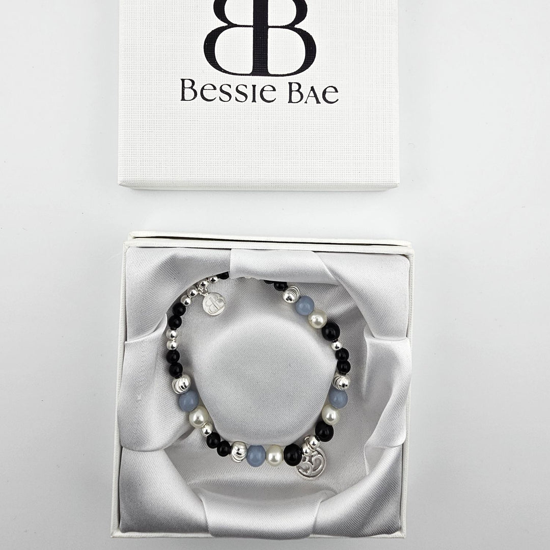 Spiritual bracelet featuring onyx, pearl, and angelite beads.