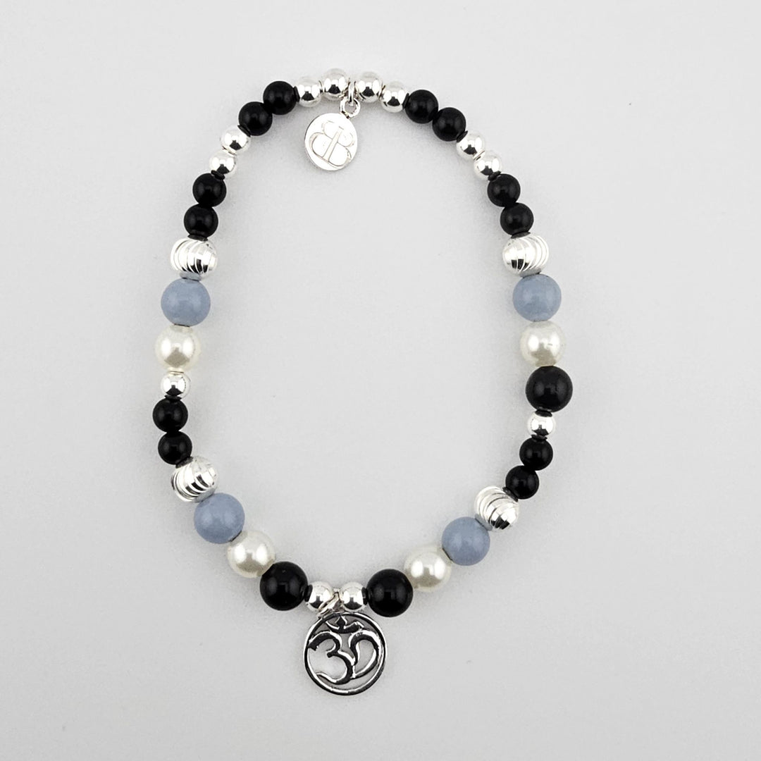 Sterling silver Om bracelet with black onyx, mother of pearl, and angelite.
