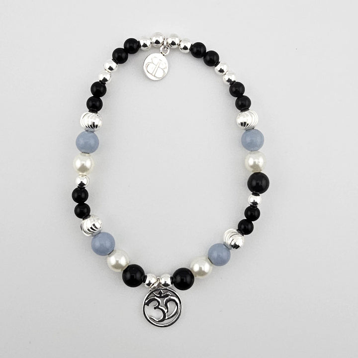 Sterling silver Om bracelet with black onyx, mother of pearl, and angelite.