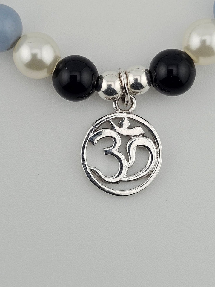 Handmade gemstone bracelet with silver Om charm.