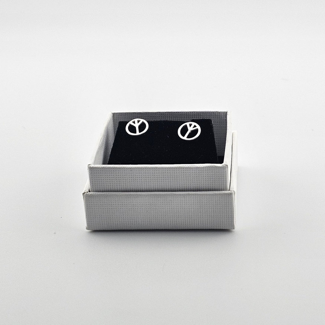 Polished silver peace sign earrings in gift box.