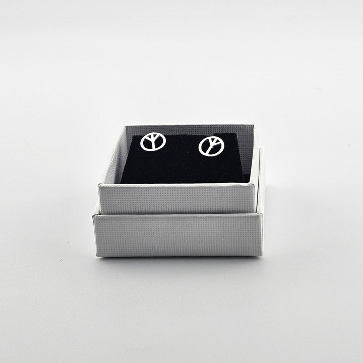 Polished silver peace sign earrings in gift box.