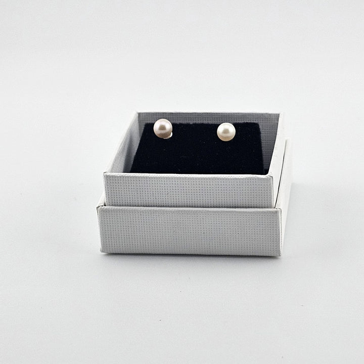Elegant freshwater pearl stud earrings in sterling silver.