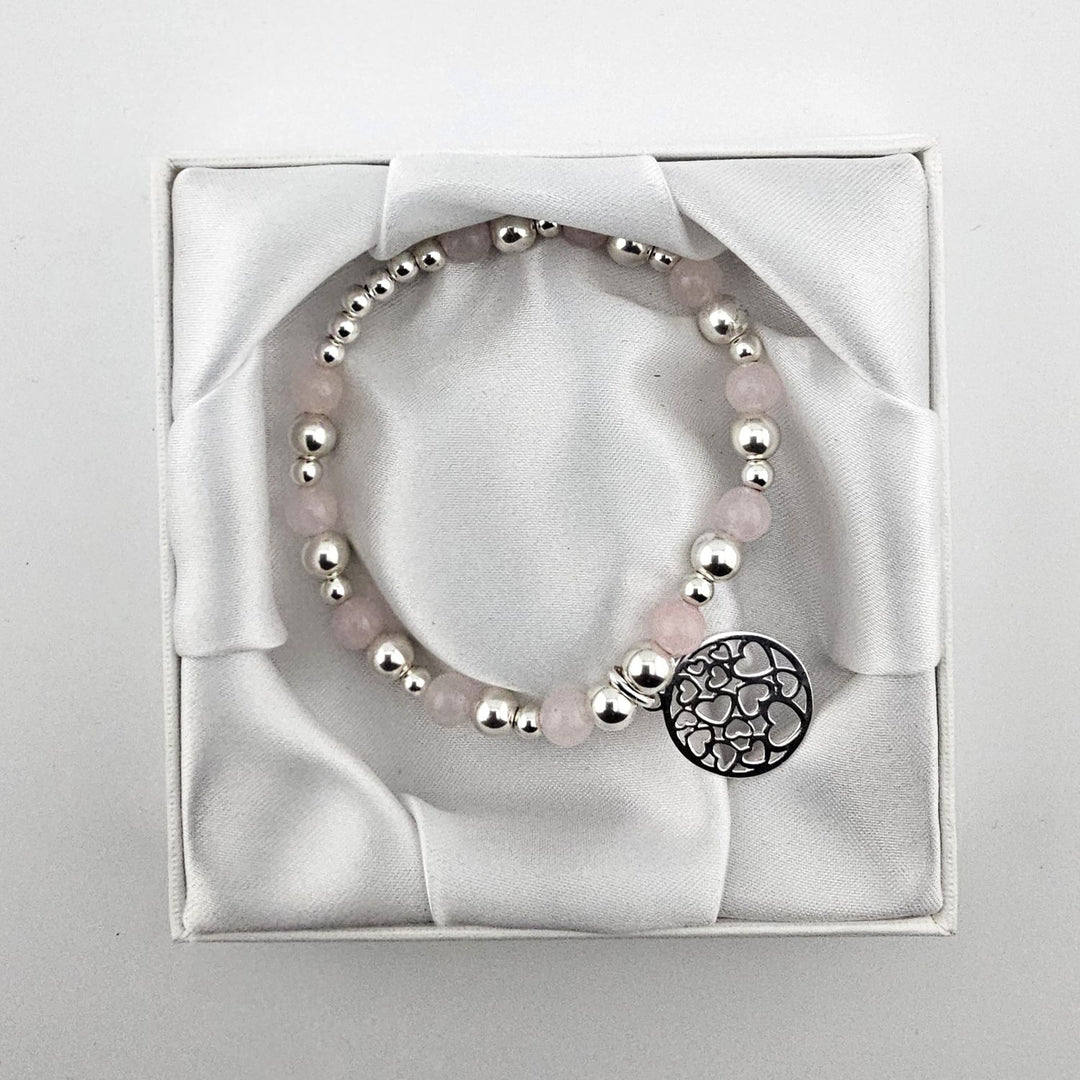 Sterling Silver and Rose Quartz gemstone bracelet displayed in box.