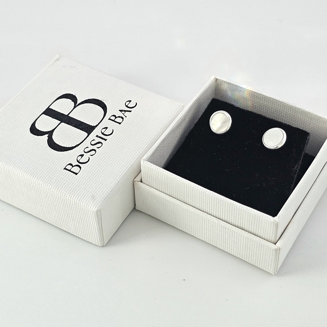 Sterling silver mother of pearl round stud earrings.