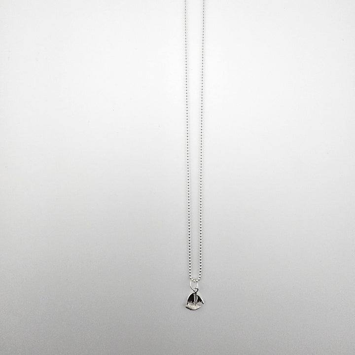 Sterling silver sail boat necklace on 18 inch ball chain.