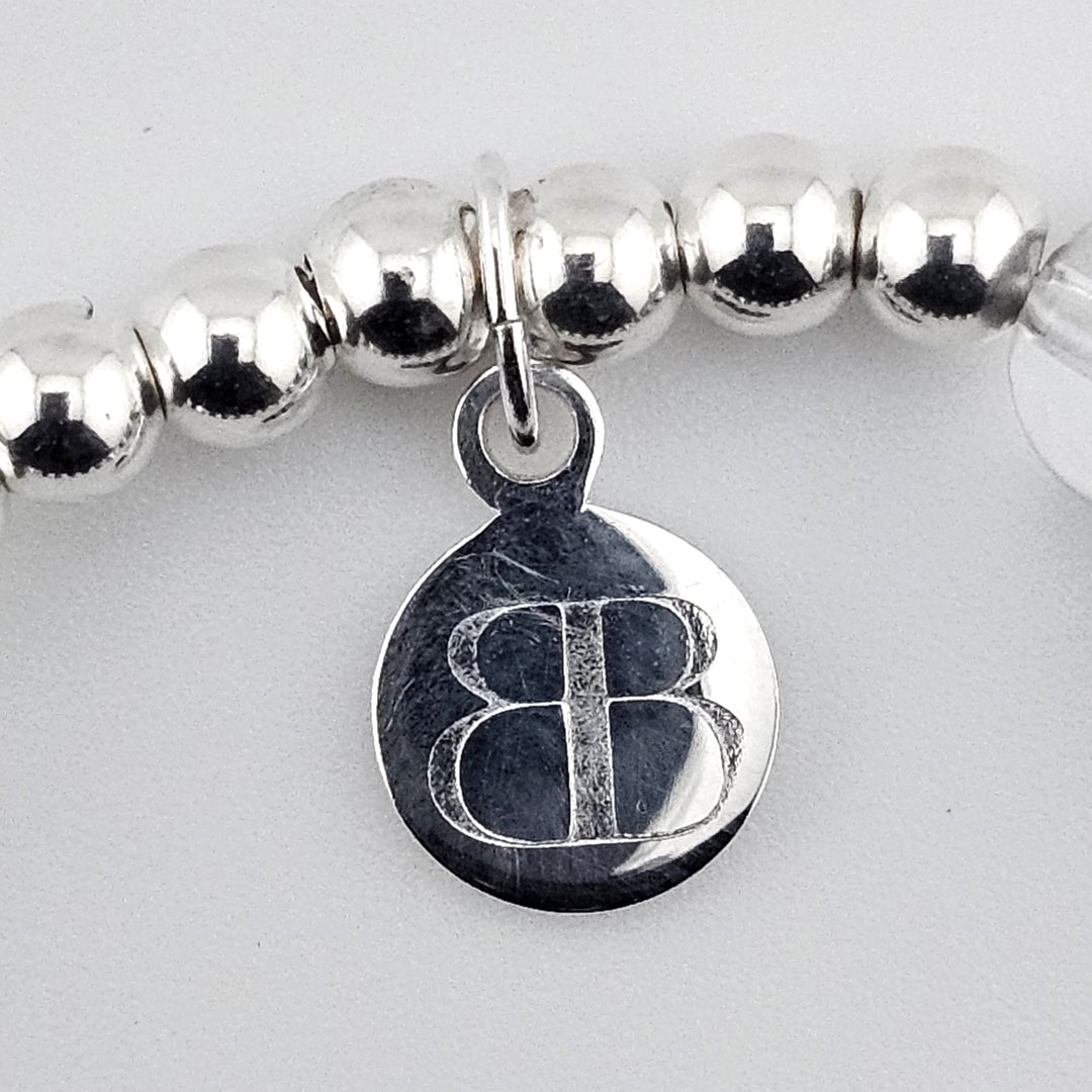 Handmade sterling silver bracelet with semi-precious stones and winter charm.