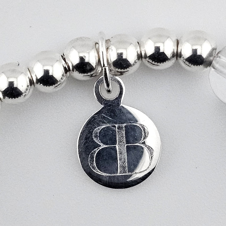 Handmade sterling silver bracelet with semi-precious stones and winter charm.